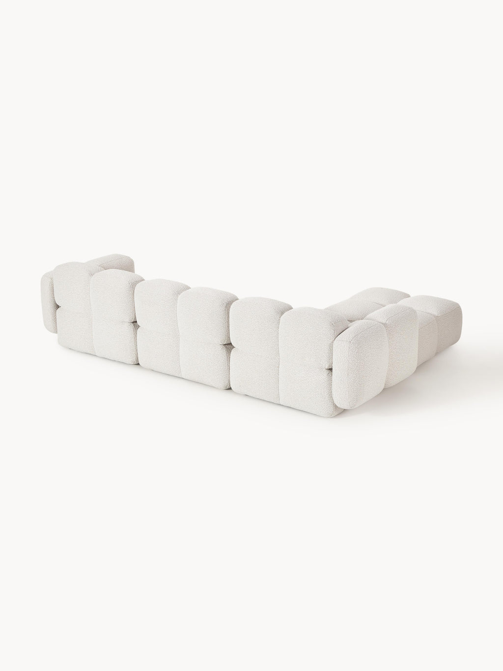 Modulares Sofa Tayla (4-Sitzer) aus Bouclé mit Hocker (links/rechts)