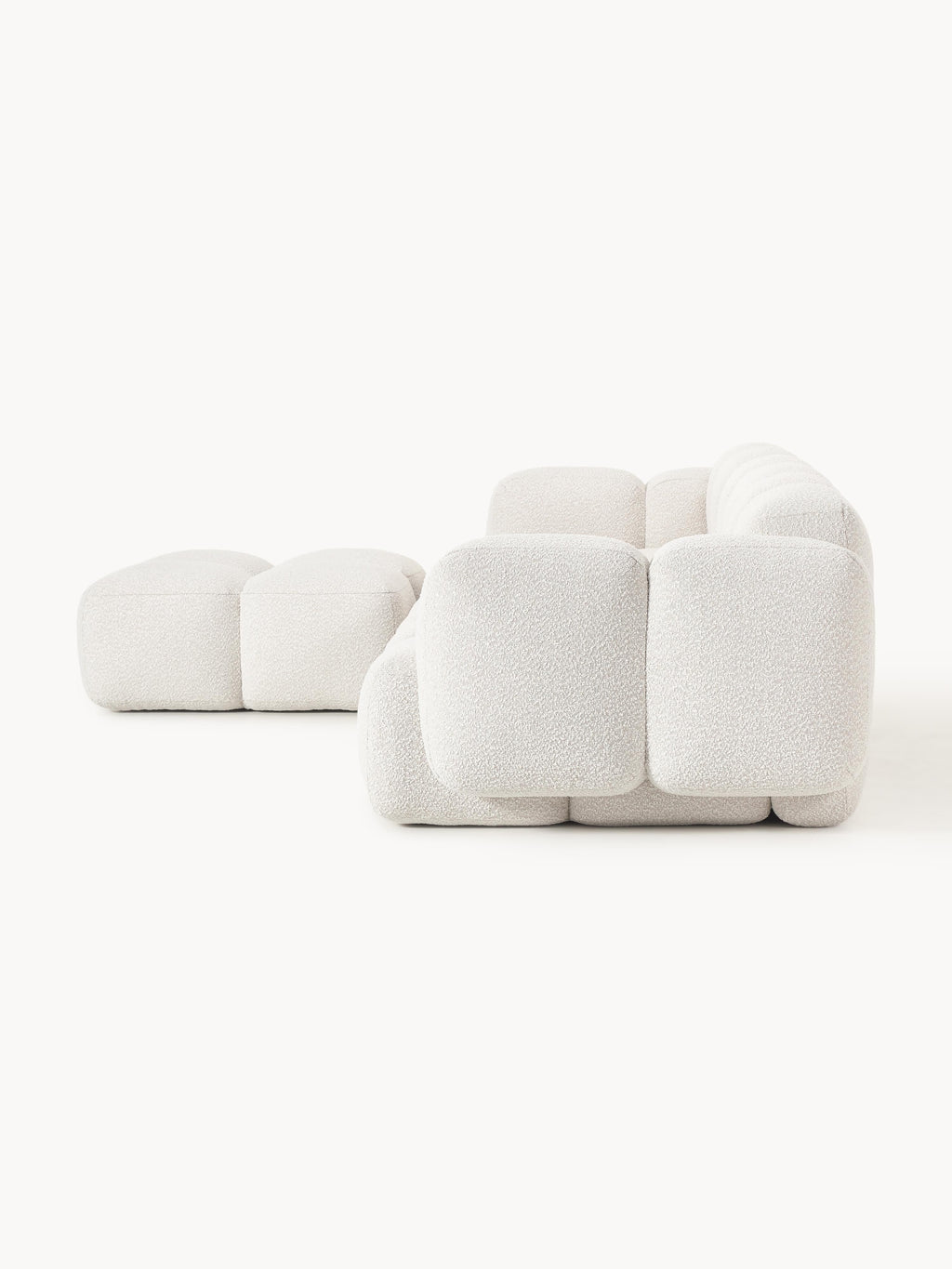 Modulares Sofa Tayla (4-Sitzer) aus Bouclé mit Hocker (links/rechts)