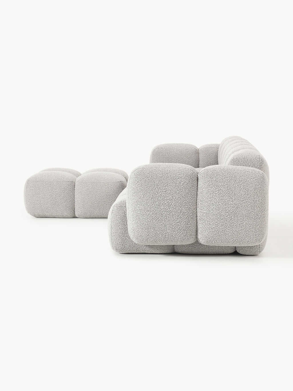 Modulares Sofa Tayla (4-Sitzer) aus Bouclé mit Hocker (links/rechts)