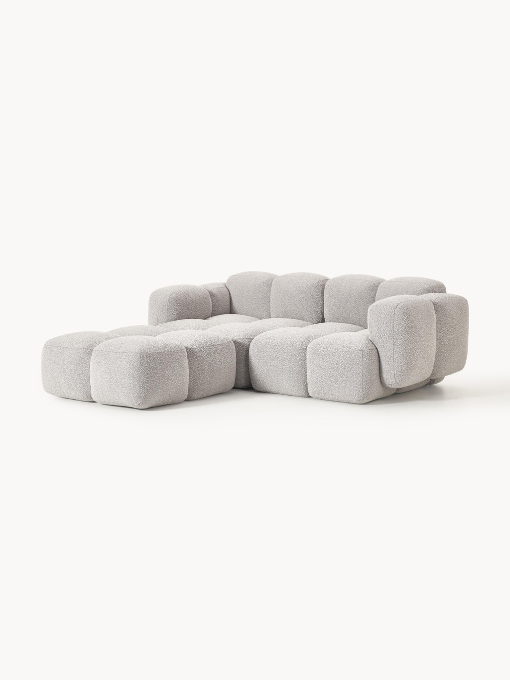 Modulares Sofa Tayla (3-Sitzer) aus Bouclé mit Hocker (links/rechts)