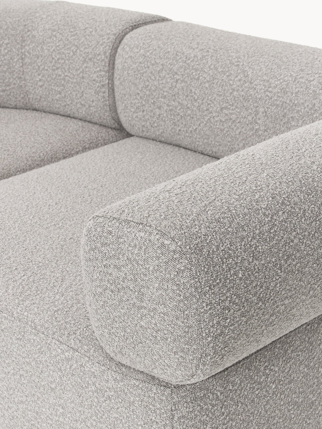 Großes modulares Bouclé-Sofa Anton mit Hocker (links/rechts)
