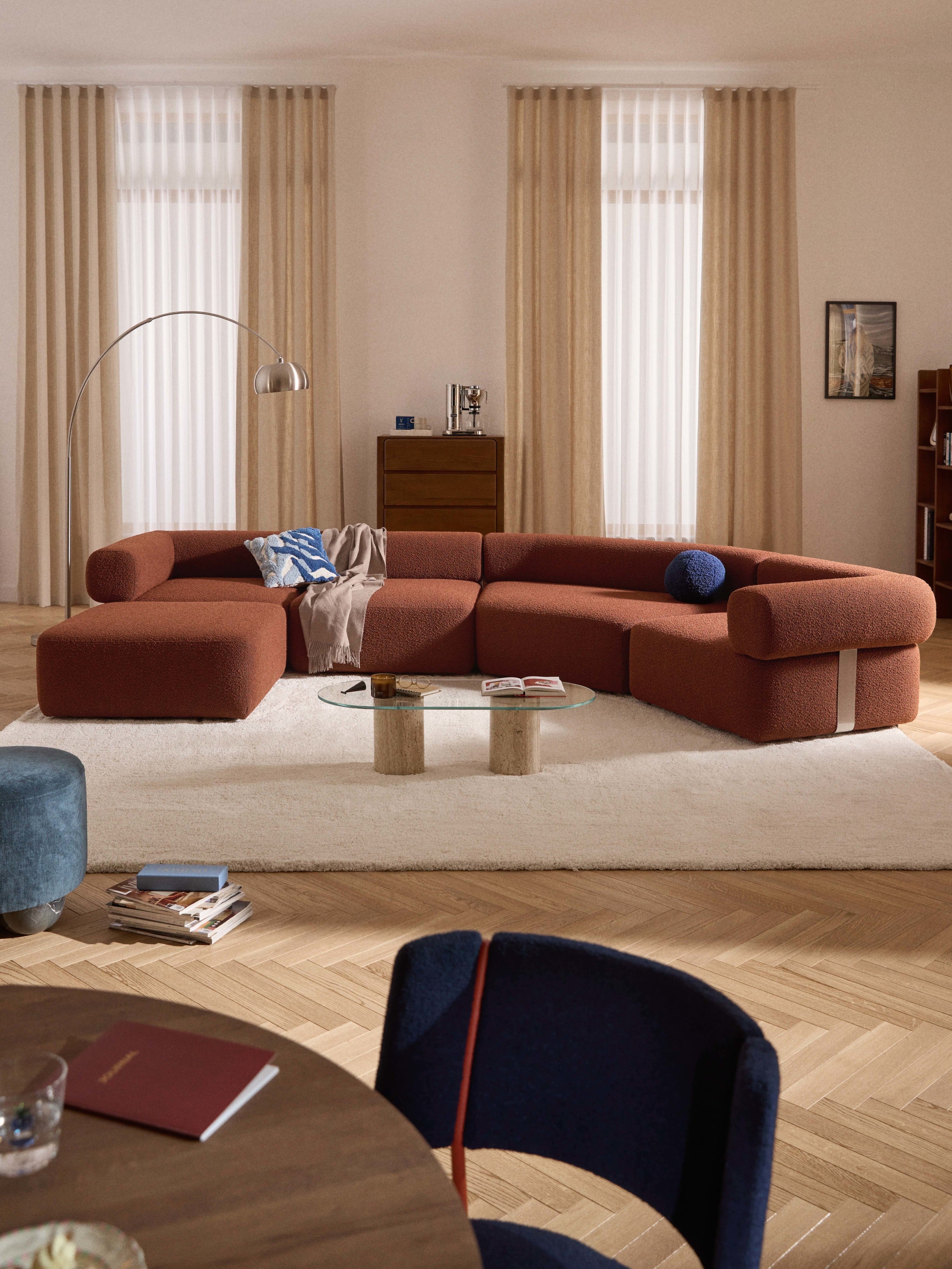 Großes modulares Bouclé-Sofa Anton mit Hocker (links/rechts)
